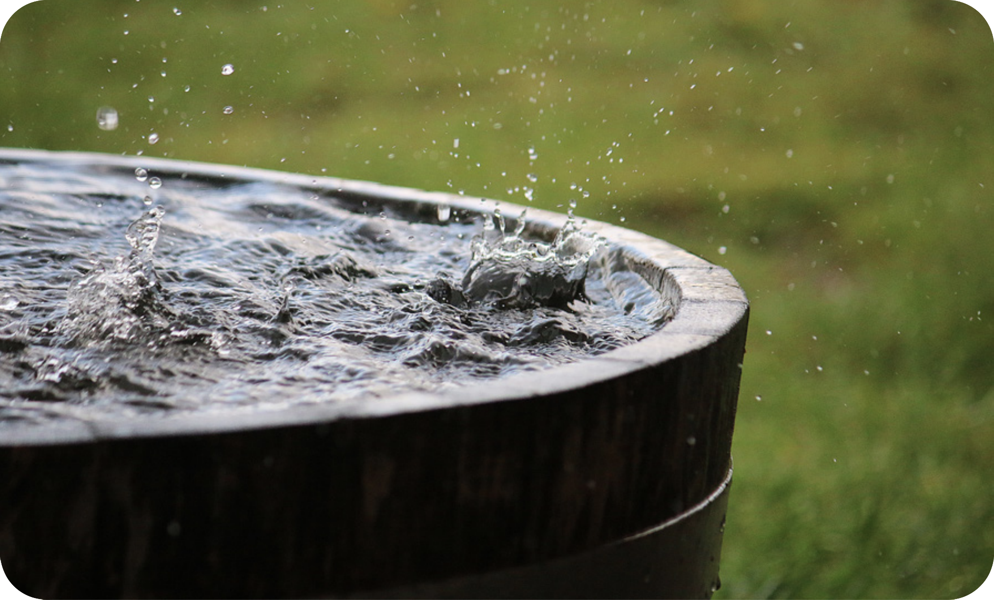 Water falling into a barrel